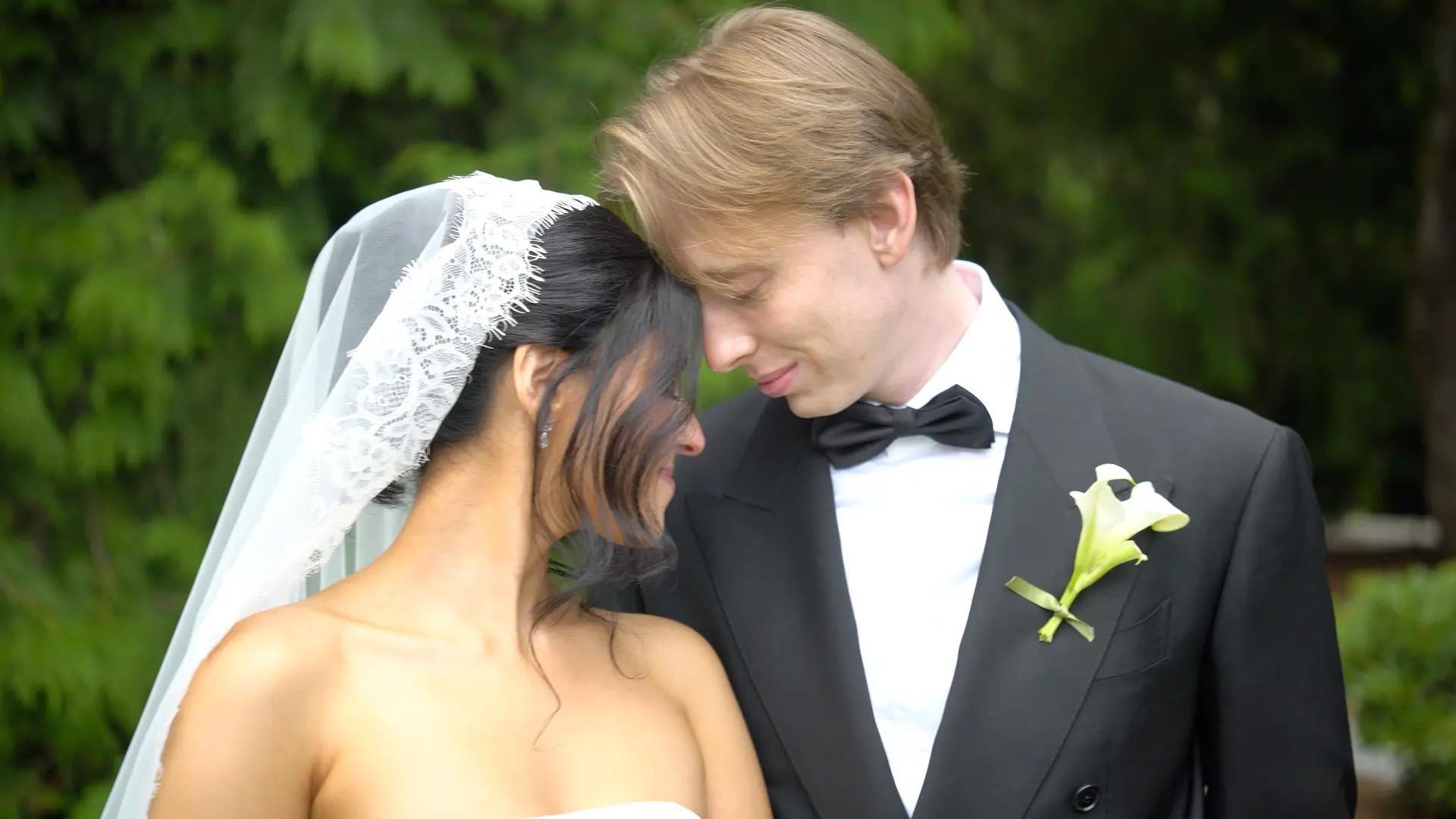 Tiffany & Mason embracing at golden hour on their wedding day